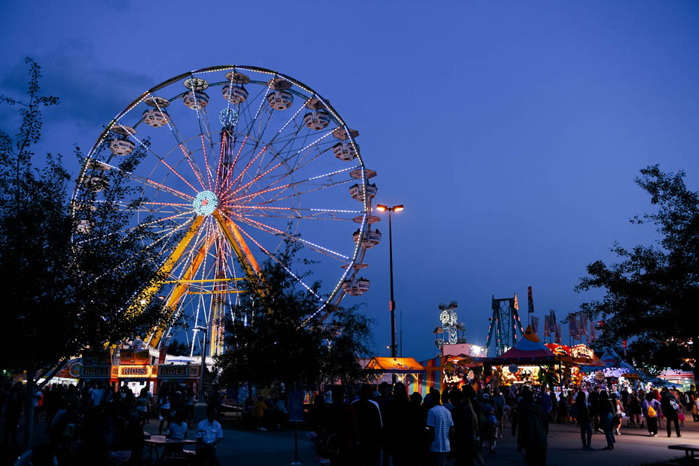 shot of k-days at night with ferris wheel