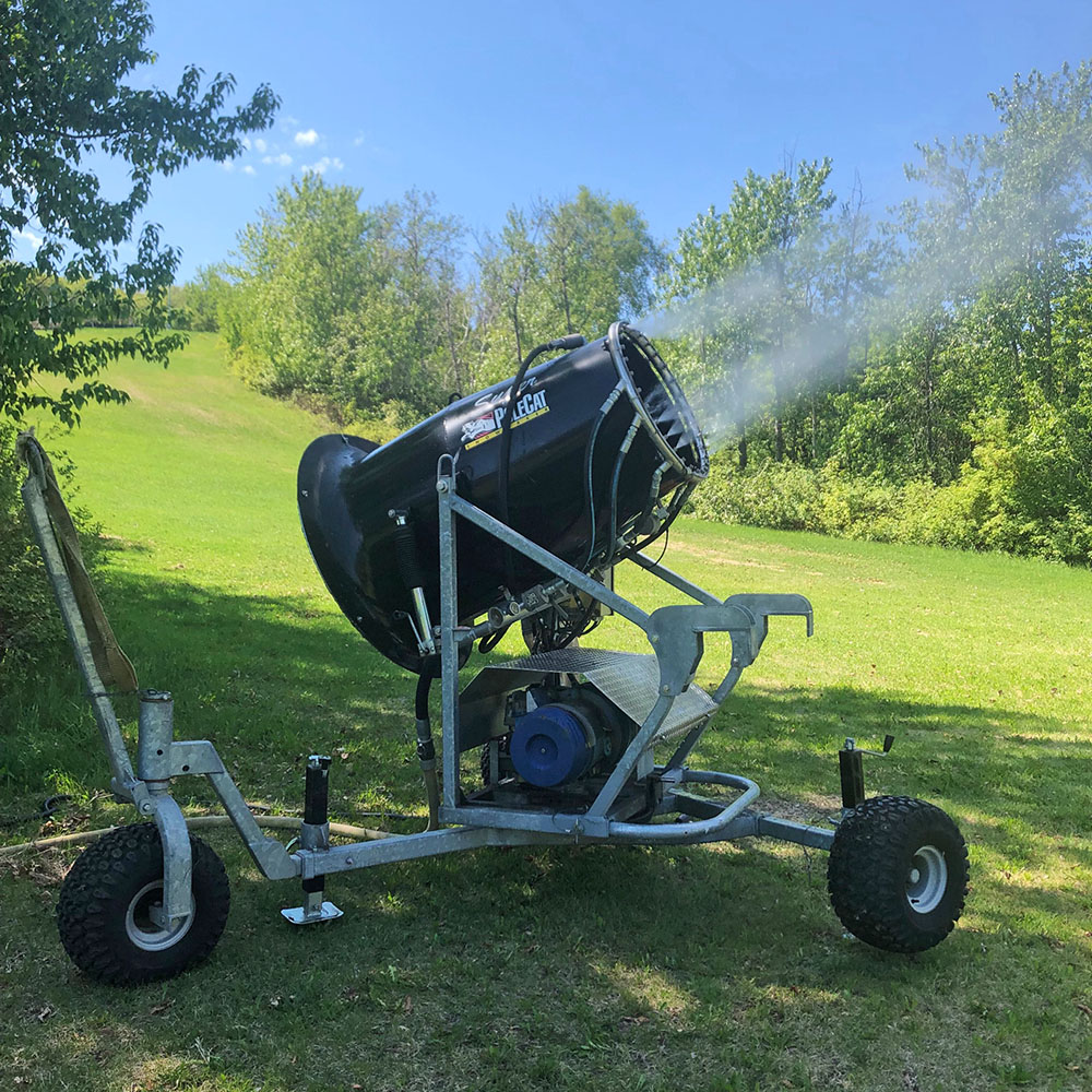 A water cannon shoots out a mist of water at Edmonton Ski Club.