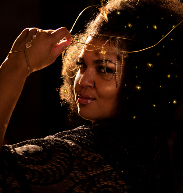 D’orjay The Singing Shaman looks over her shoulder at the camera