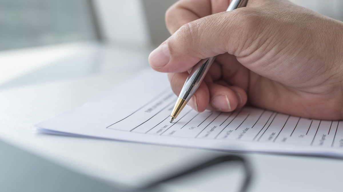 someone filling out tax paperwork