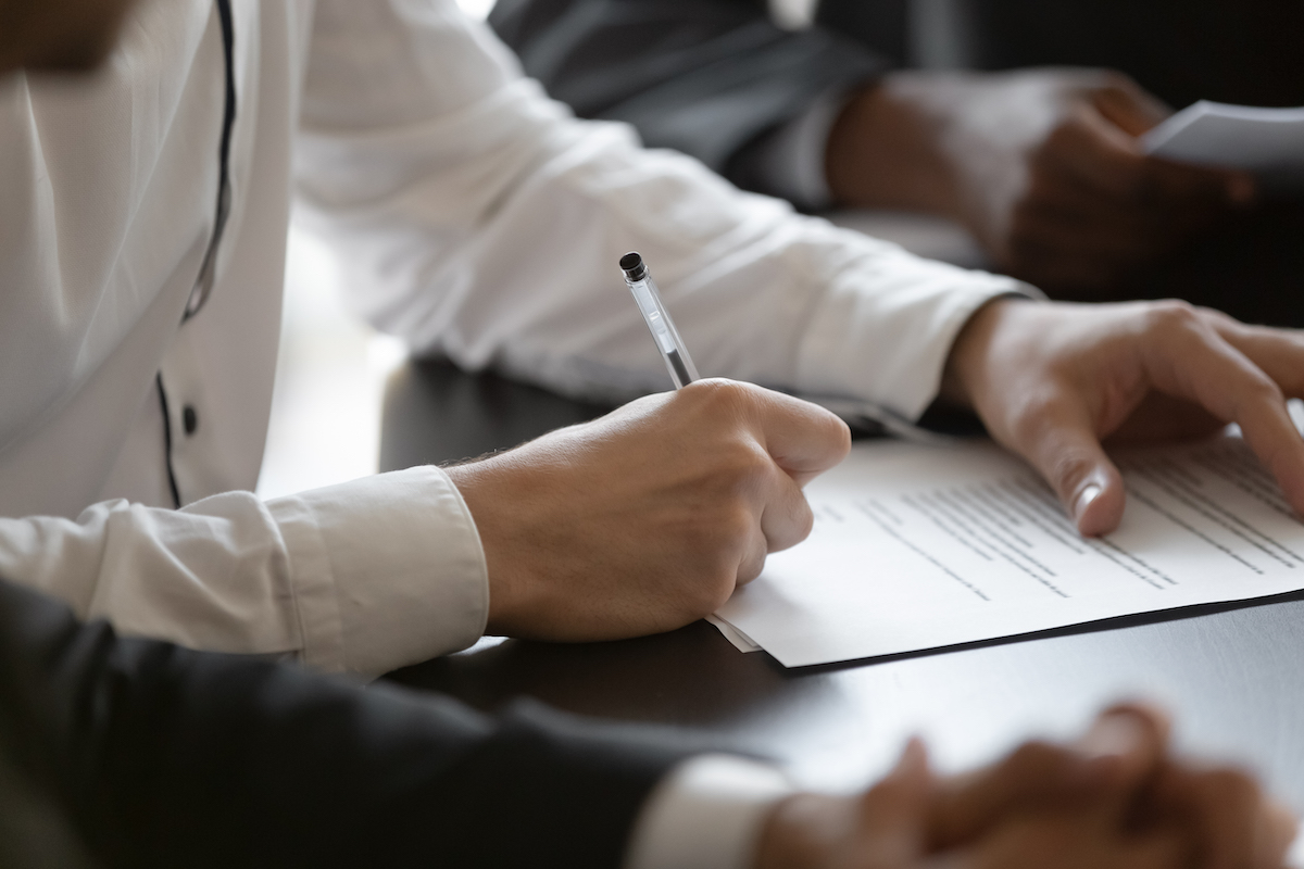 person signing license paperwork
