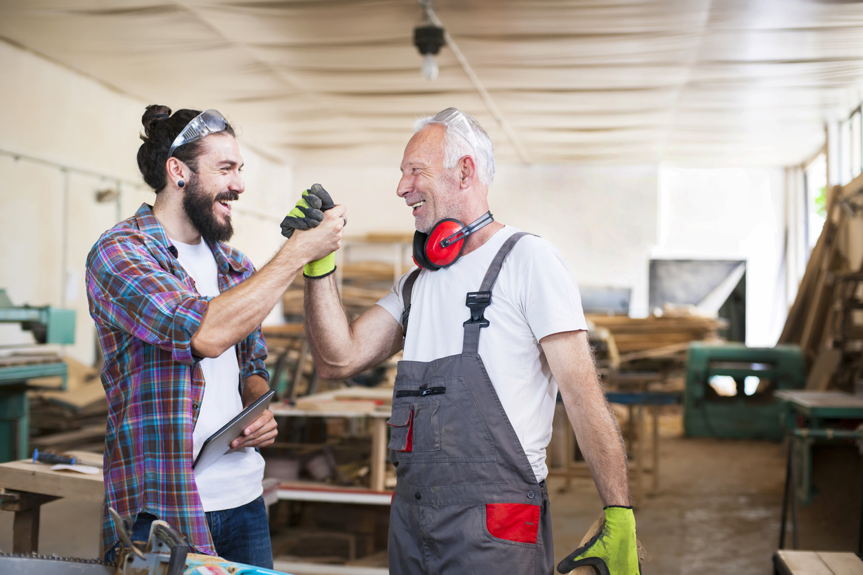 two men celebrating in shop