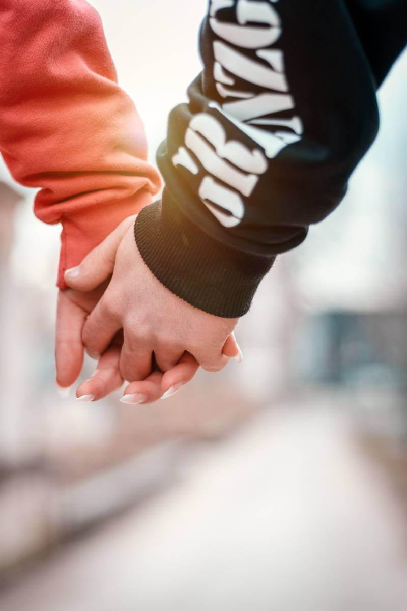 two people holding hands