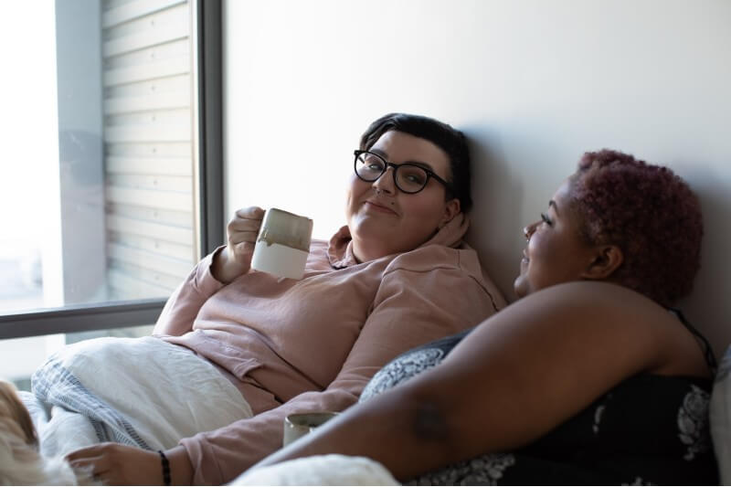 women having coffee in bed