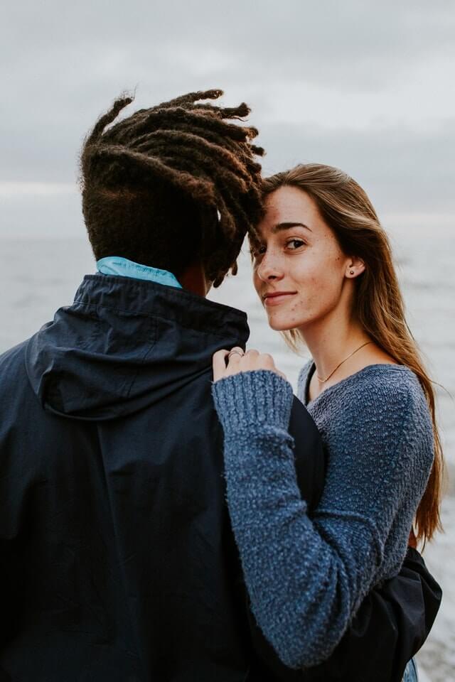 man and woman wearing blue long sleeves