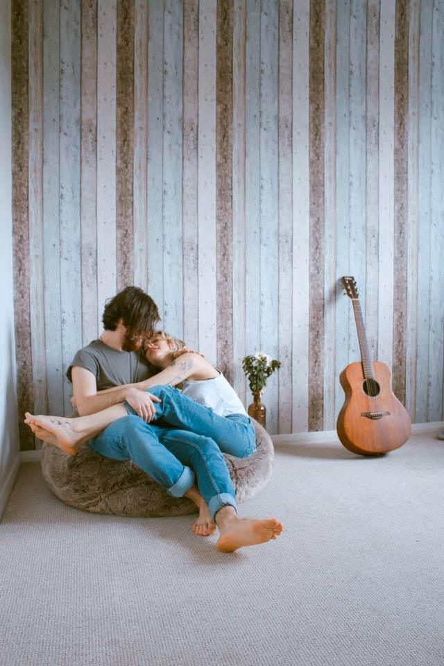 sitting couple cuddling