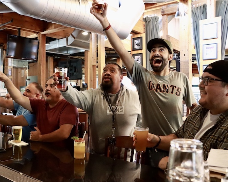People celebrating at sports watch party