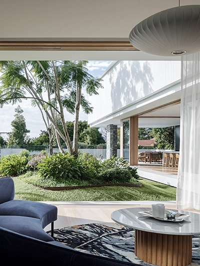 The view of the garden from inside the Boomerang House
