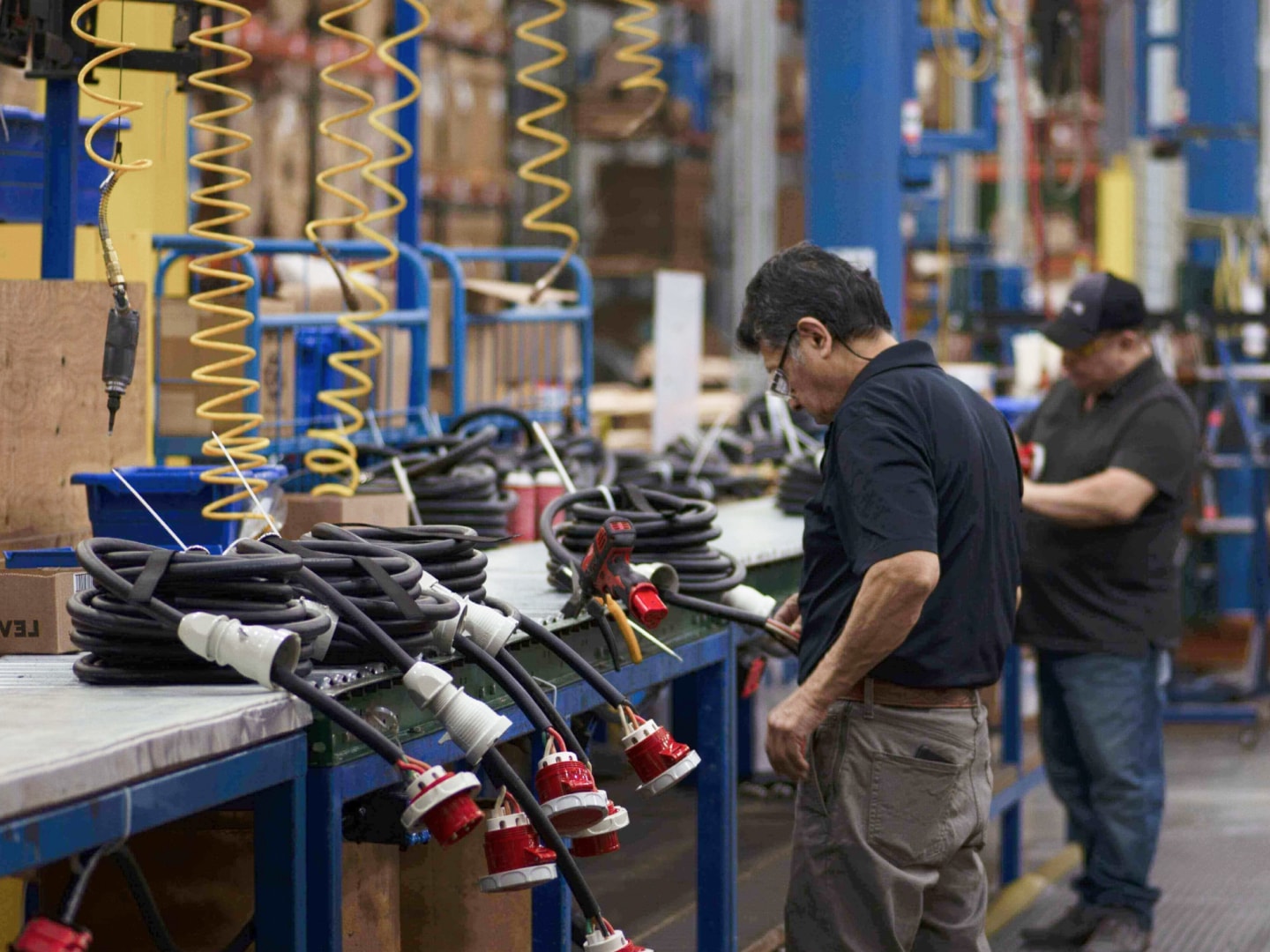 Workers building machinery