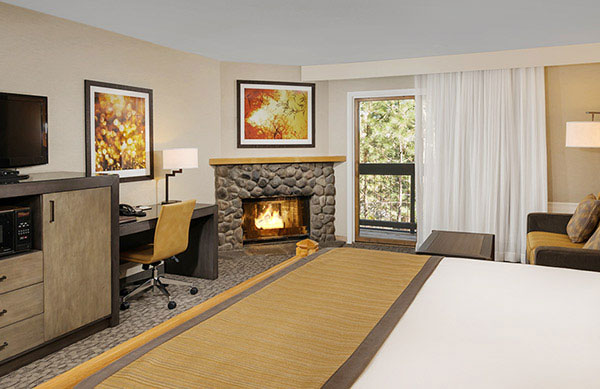King bed room with fireplace and balcony