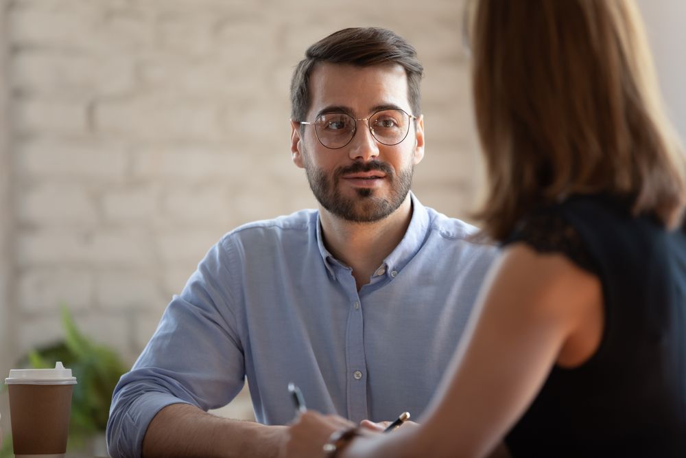 A man and a woman having a conversation.