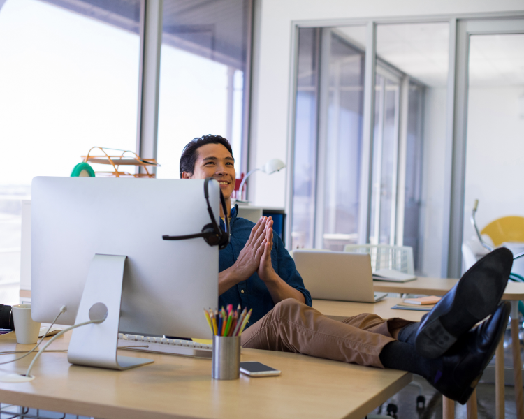 Man with his feet up on his desk
