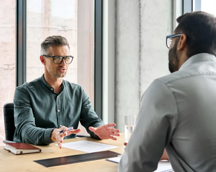 2 sales professionals practicing role playing for their next sales call.