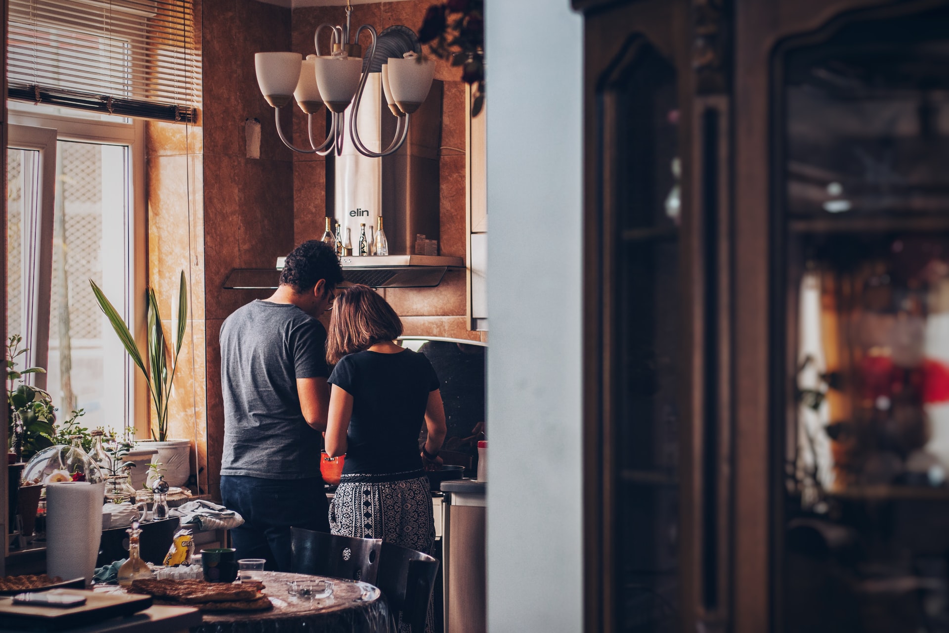 a couple making breakfast in their home
