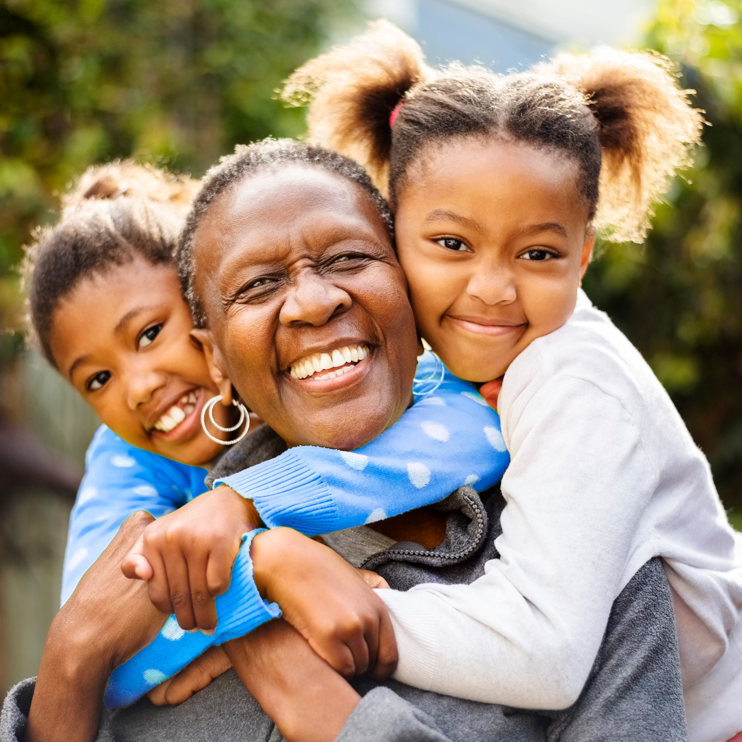 Happy mom and two daughters