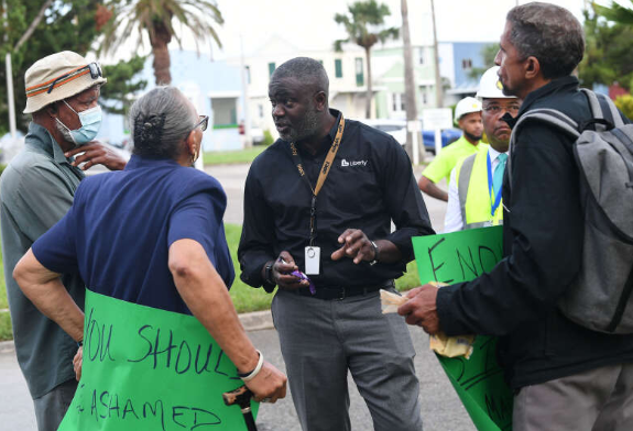 A confrontation between electricity supplier Belco and protesters angry at a recent fuel price hike was defused after the groups held informal talks. About a dozen demonstrators gathered outside Belco’s headquarters on Serpentine Road for a second day of protests yesterday