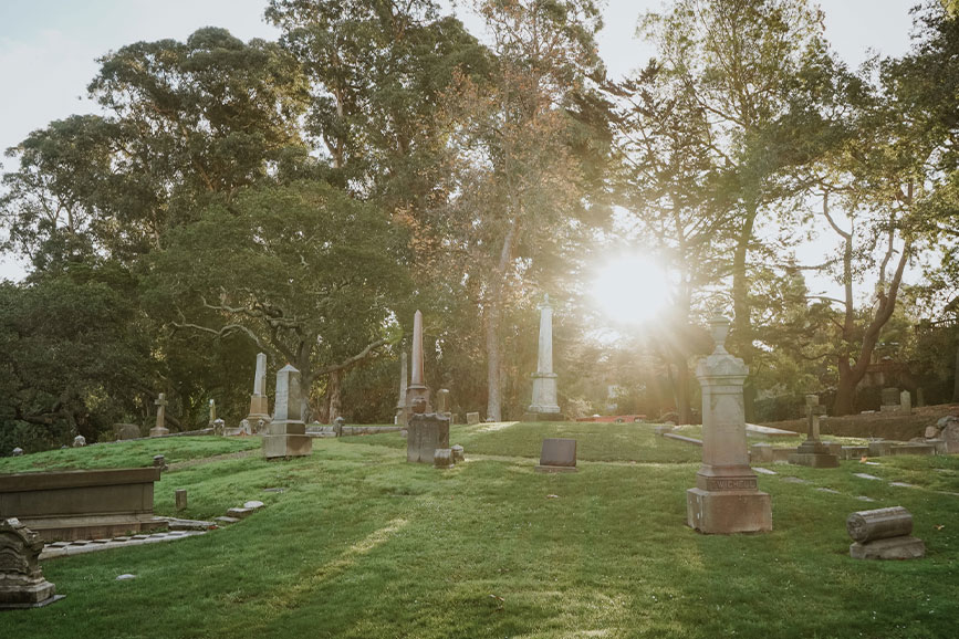 A sunrise over a cemetery.