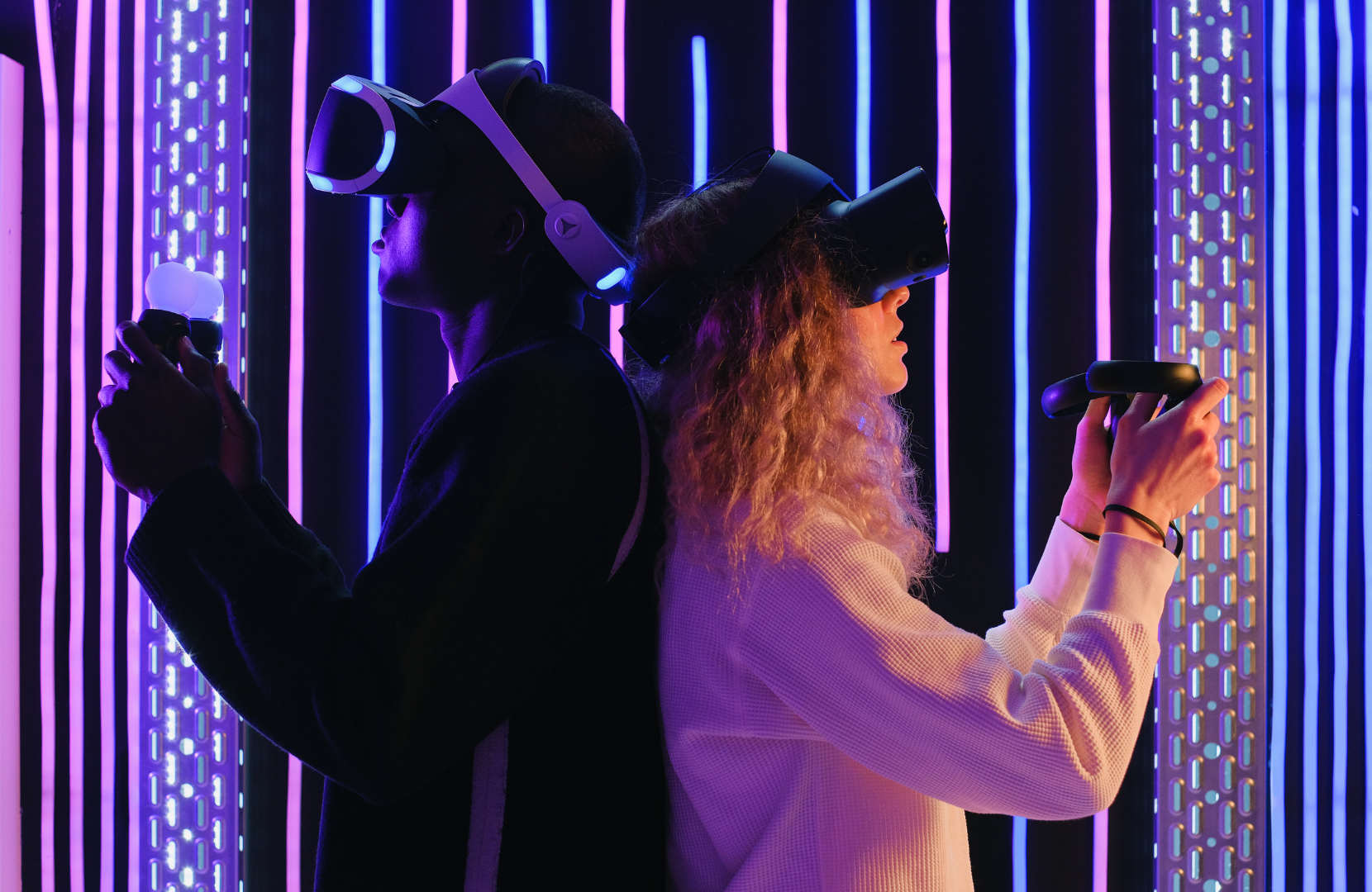 Two people playing a Virtual Reality game. 