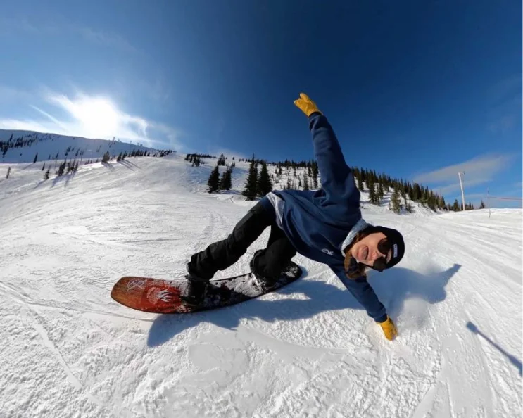 Autumn striking a pose while snowboarding