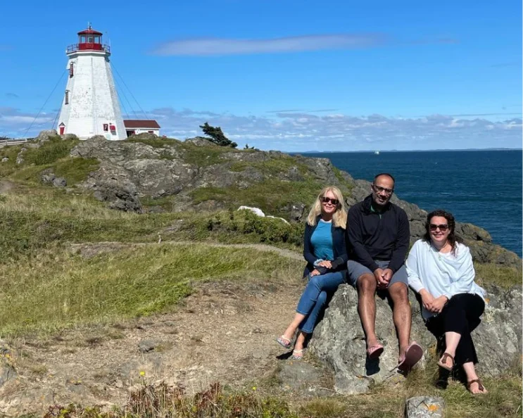 Tucows employees Trish, Monica and Dave enjoying the view of the ocean