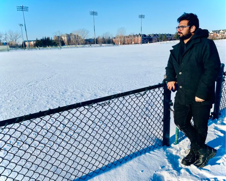Krunal looking out over a snow covered field