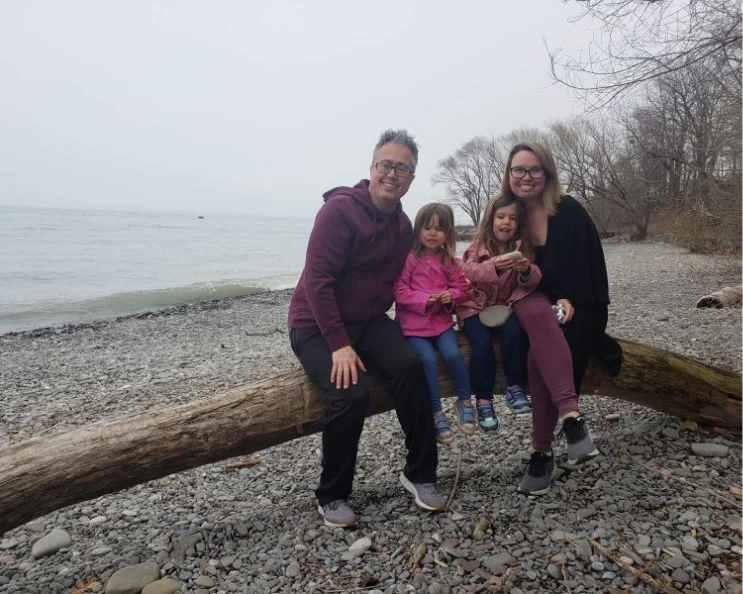 Jason with his family on the beach