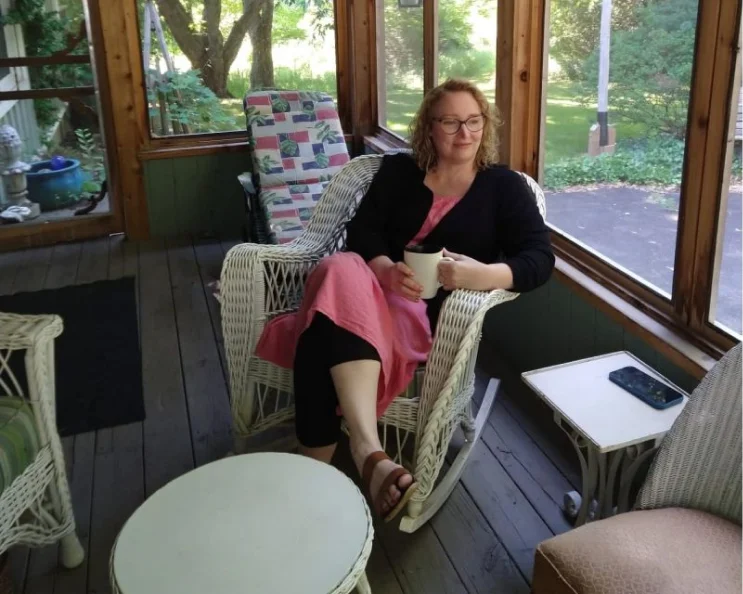 Marianne enjoying a quiet coffee moment at her cottage