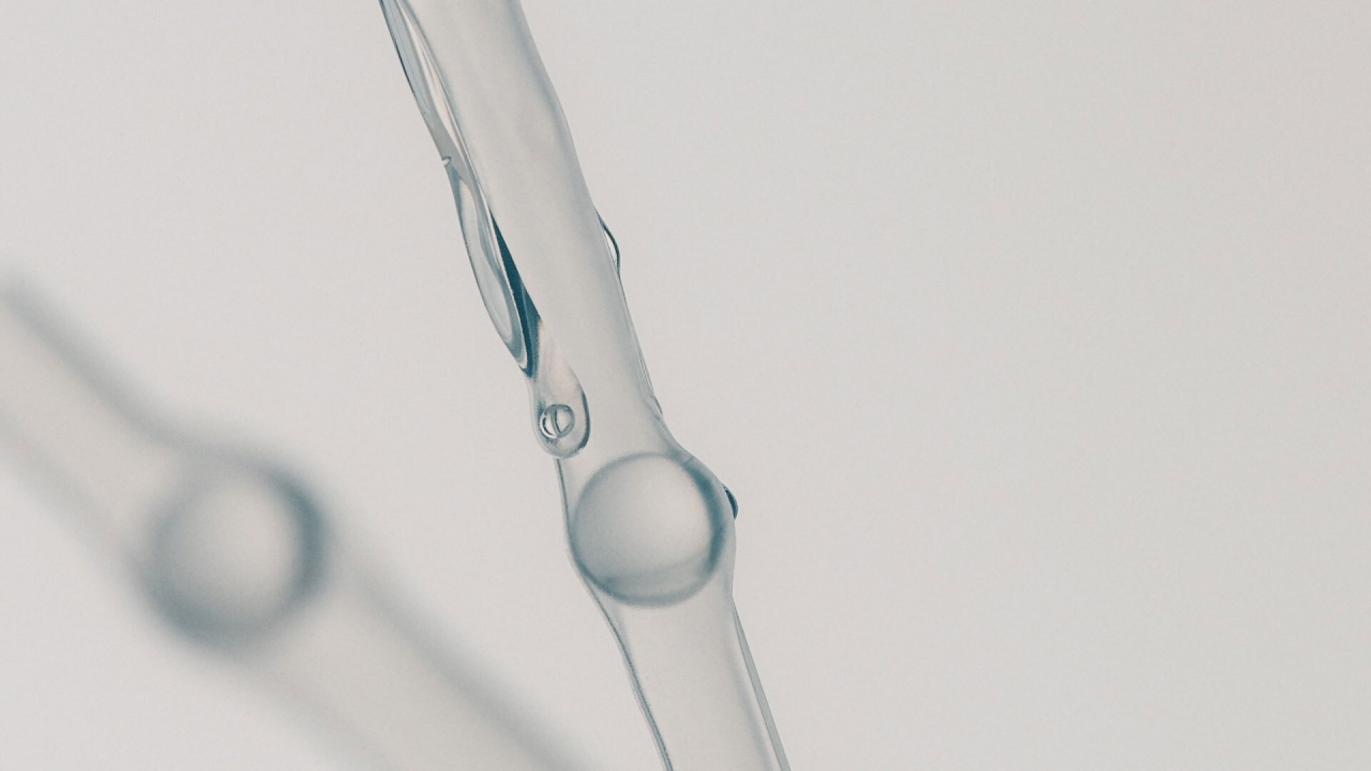 White bubbles on grey background.