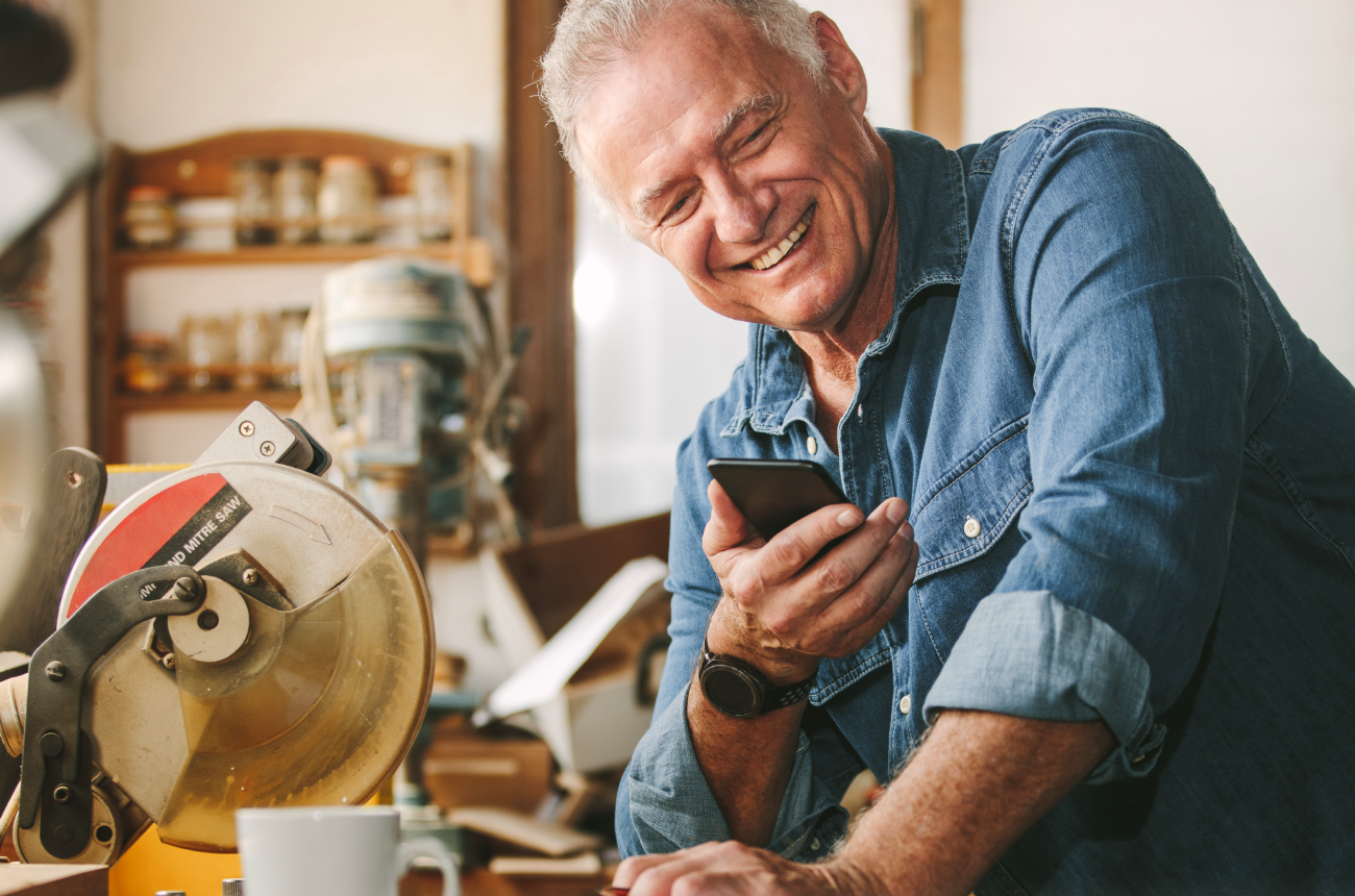 Older man holding phone