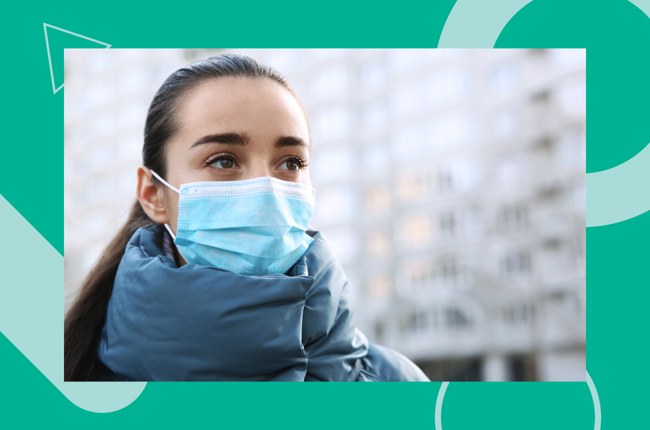 brunette woman outside in cold weather wearing mask