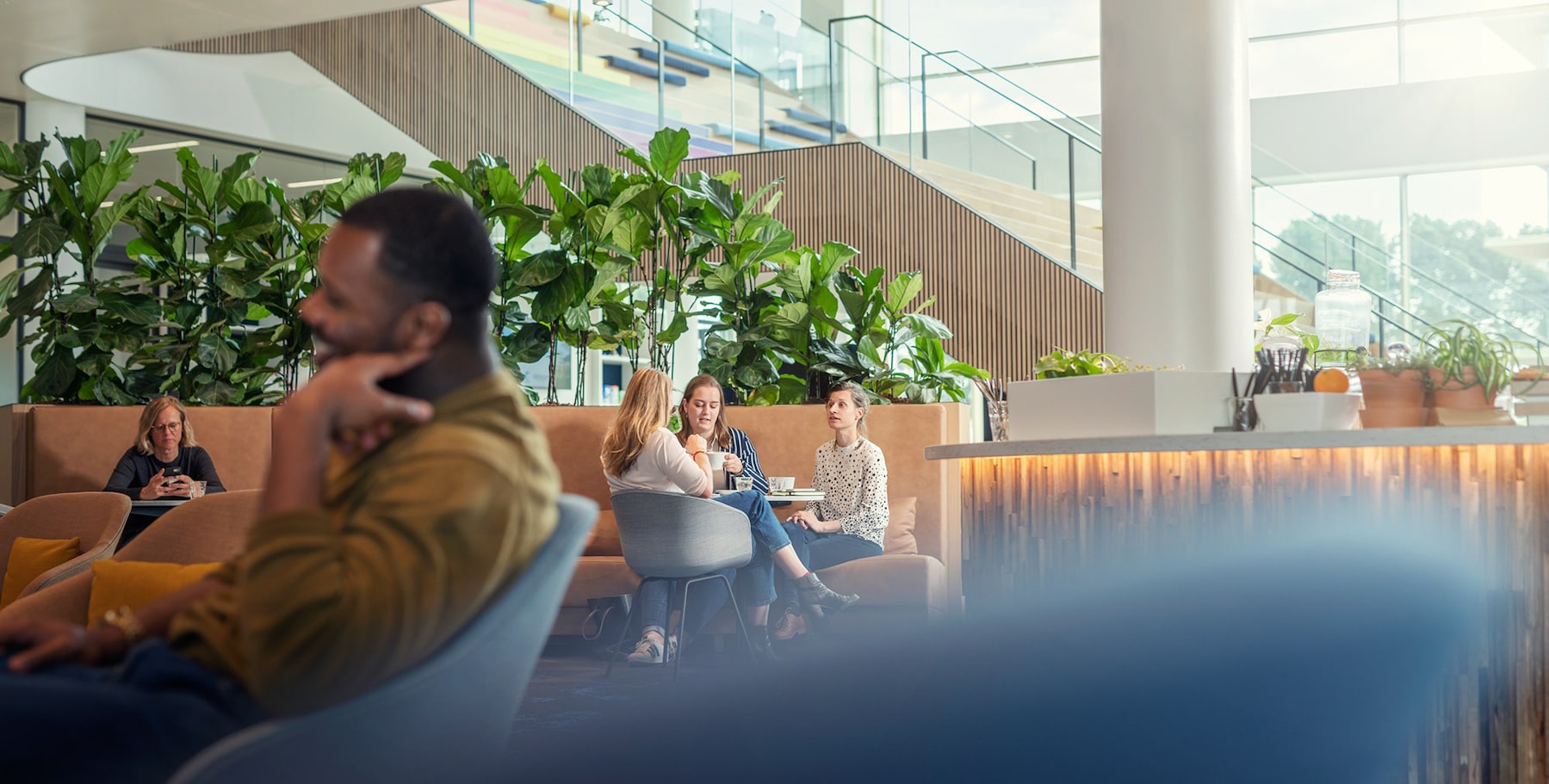 open workspace man sitting on couch