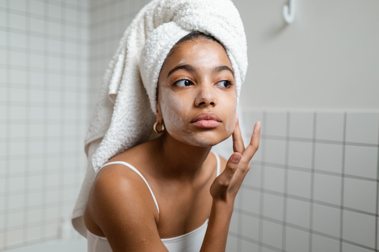 Woman-applying-face-cream