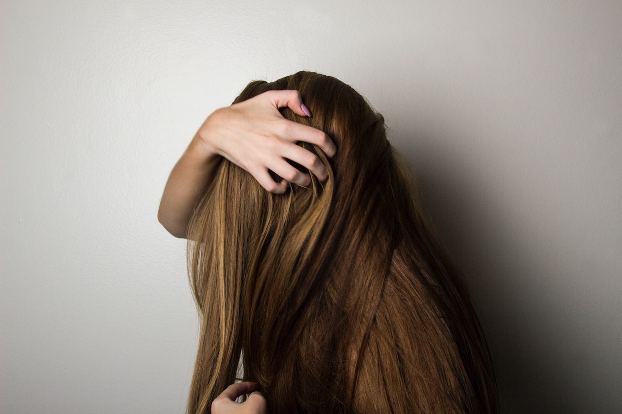 Woman touching her hair