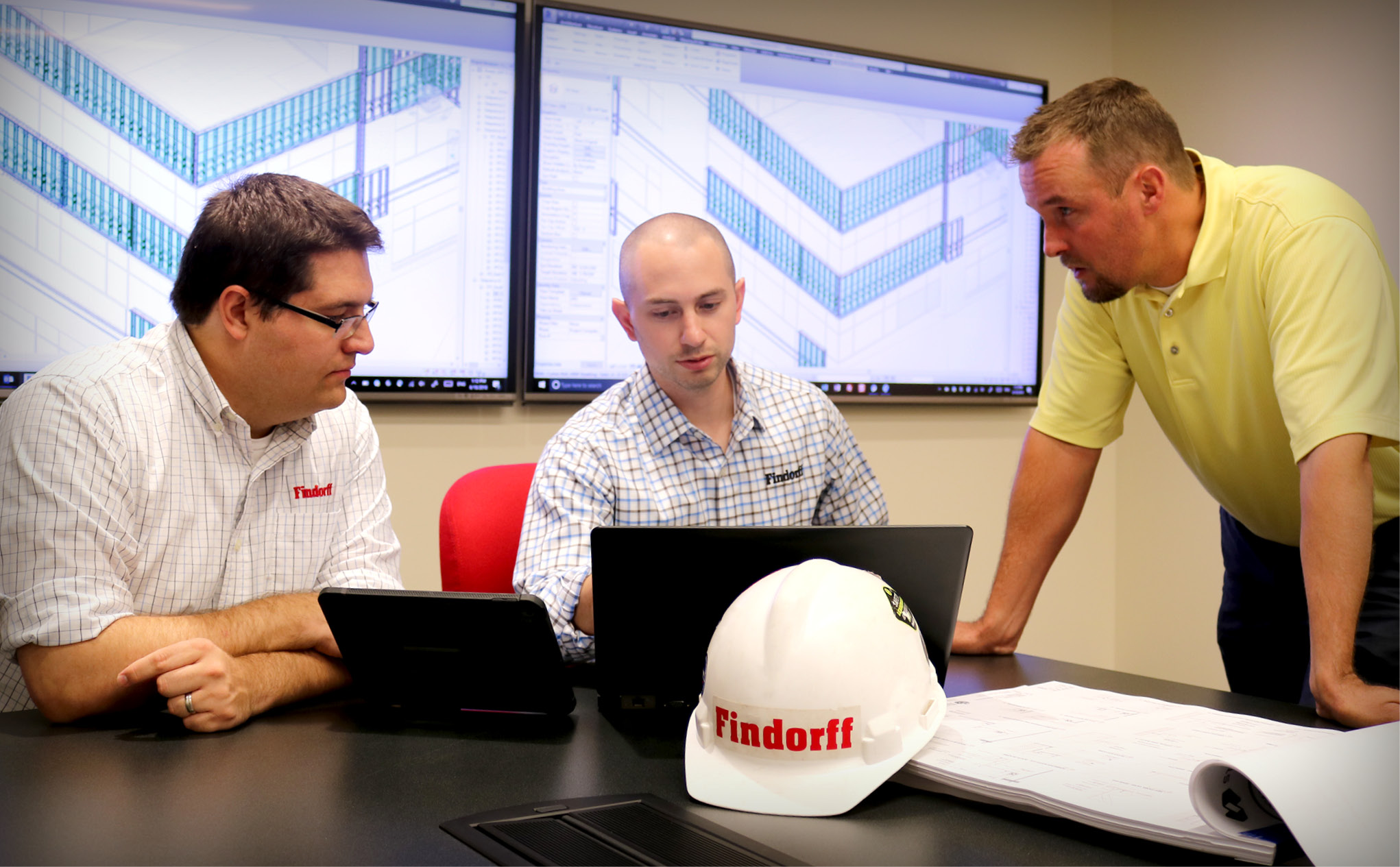 three people working