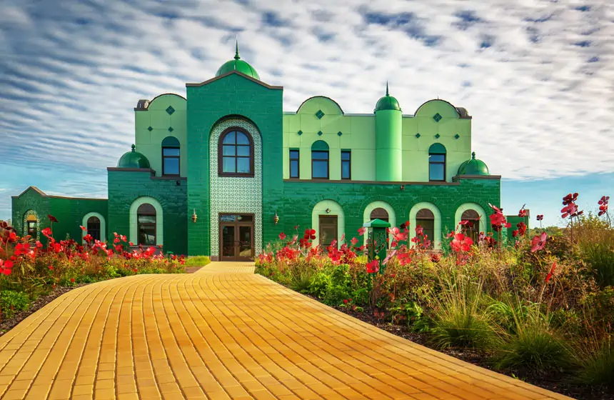 green office building with yellow brick road