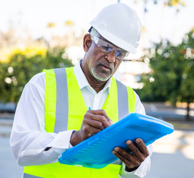 Maintenance worker filling out form