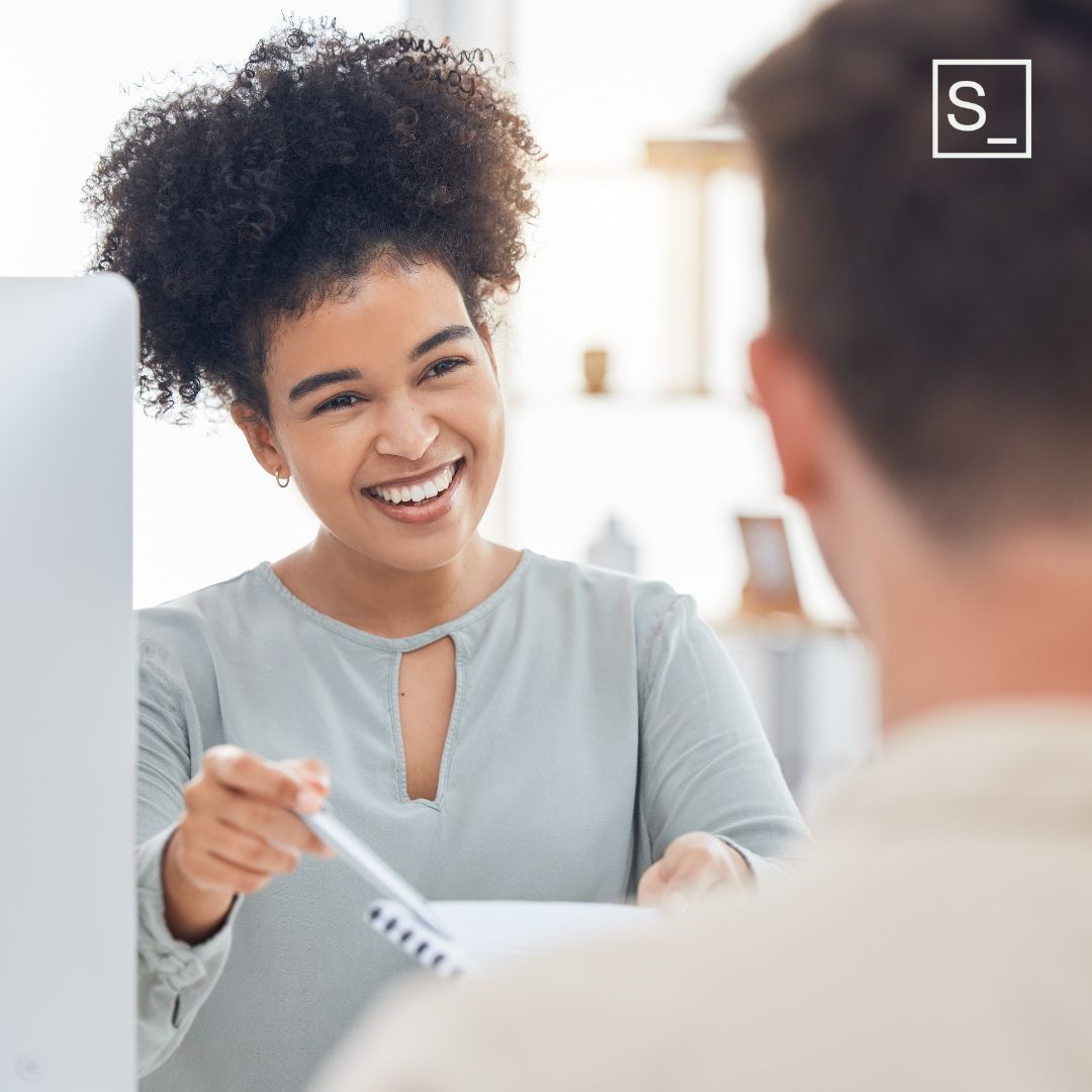 Woman onboarding a new employee.