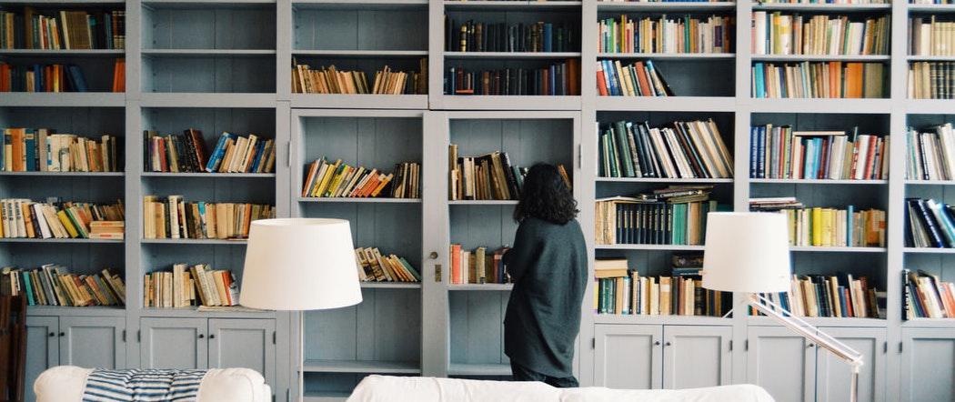 Woman looking at bookcase