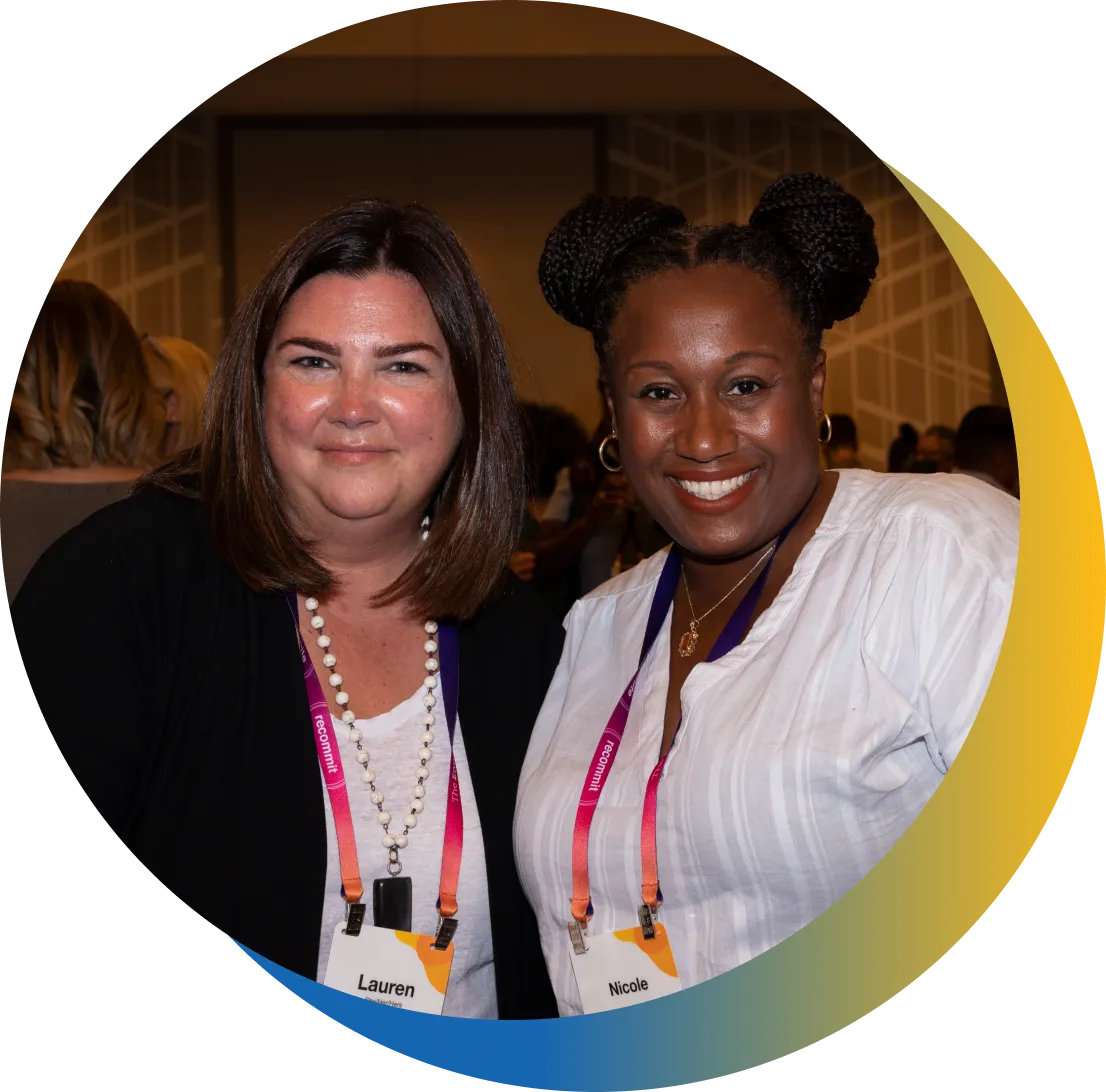 Two smiling female EMA members posing for a photo.