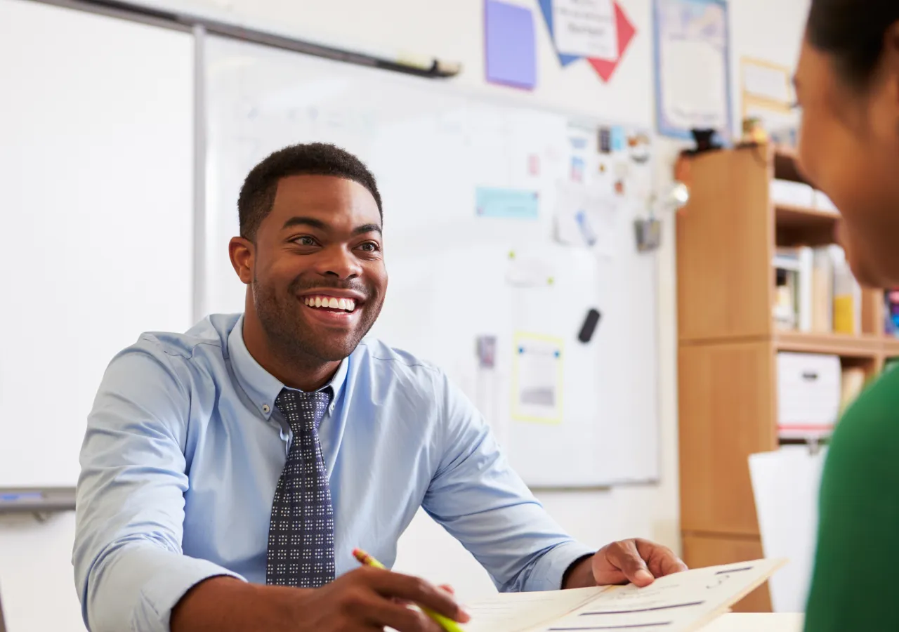 An admission officer interviews an applicant.