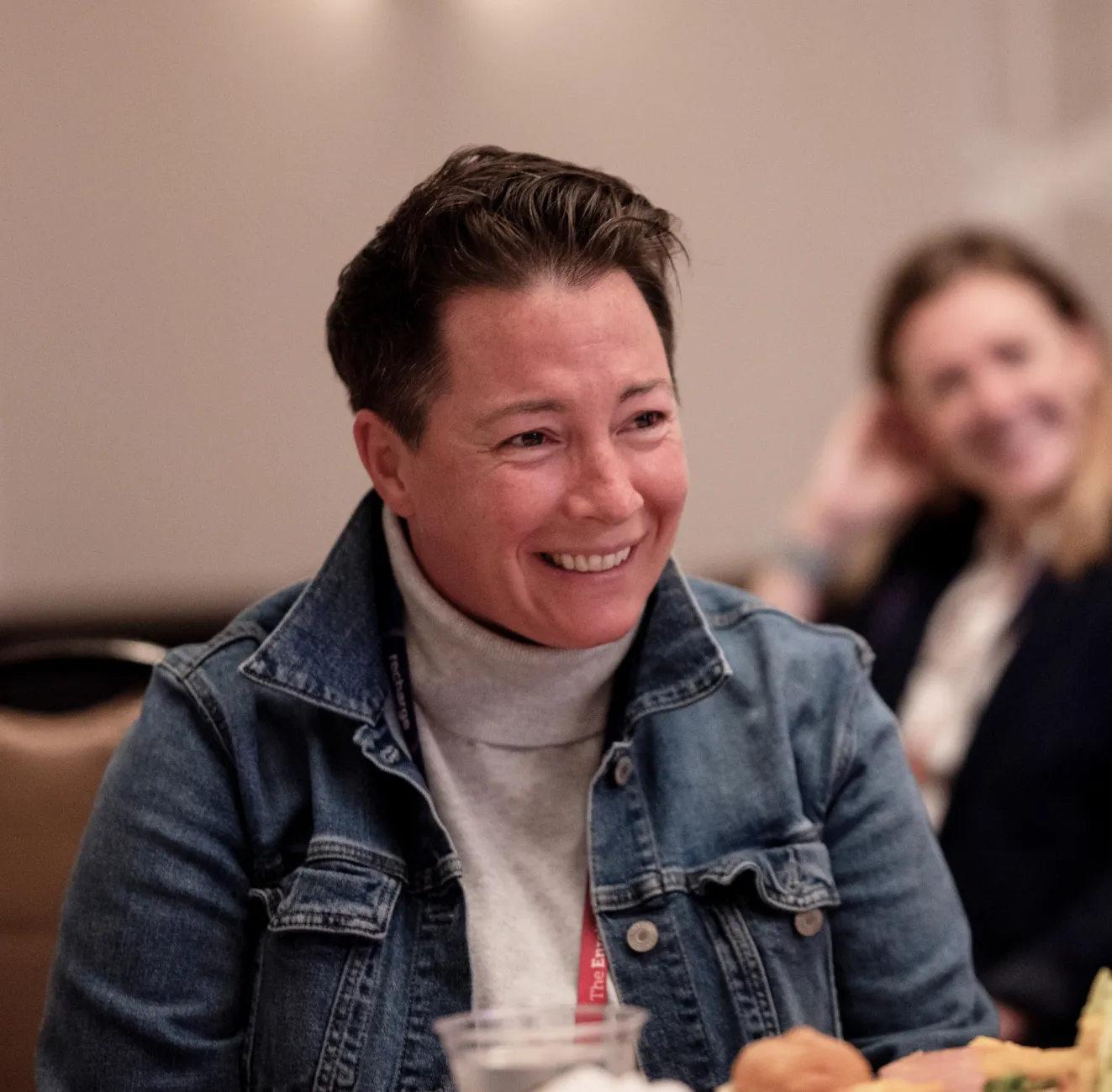 An Admission Leadership Council member laughing during a group meeting.