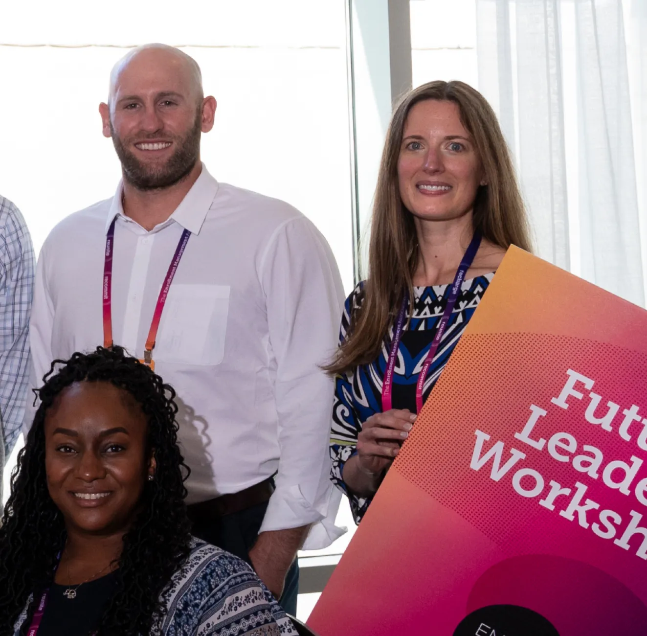 Christina Dotchin holding a "Future Leaders Workshop" sign and posing with attendees of the seminar.