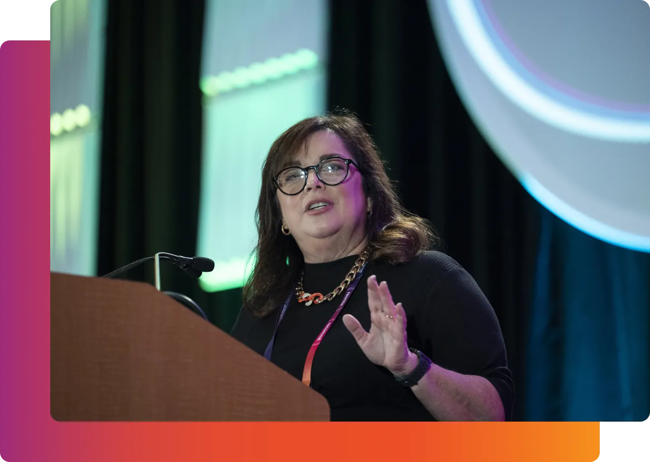 Heather Hoerle on stage speaking at EMA's annual conference.