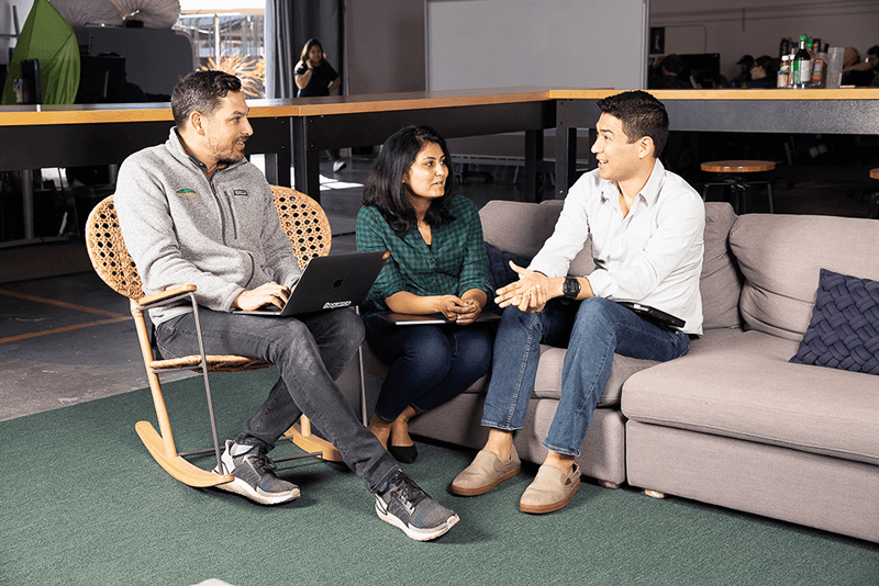3 people talking on couches