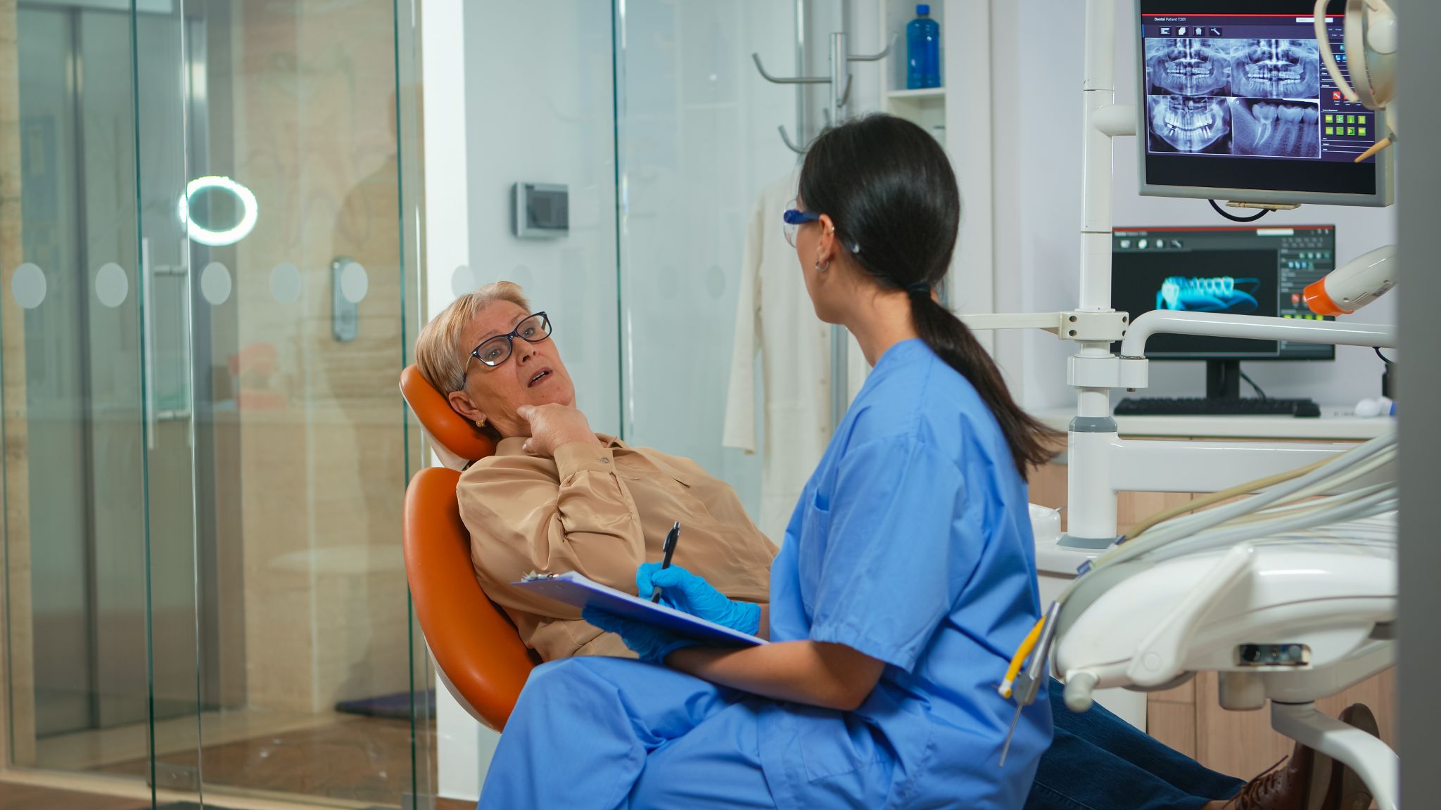 provider talks to a patient in the operatory