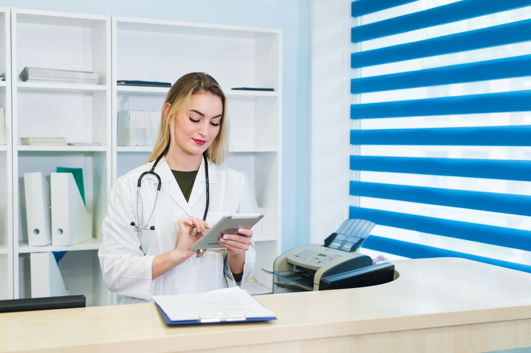 dentist counter-signs a patient consent on their tablet