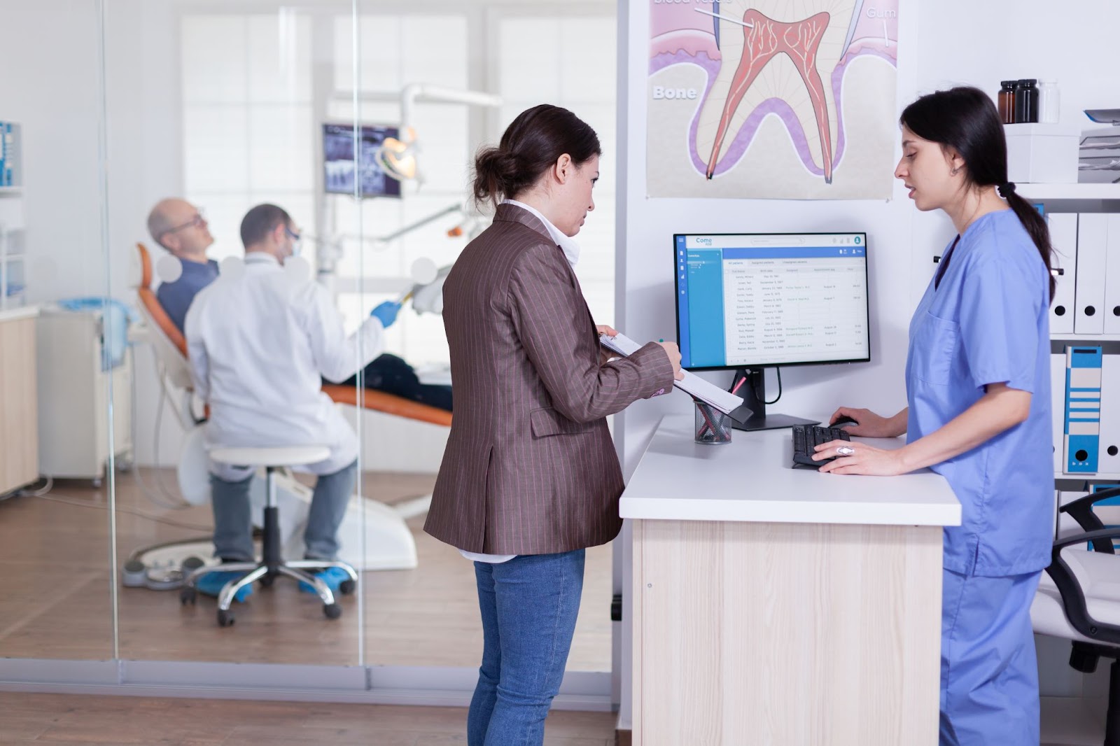 dental patient checks out at reception