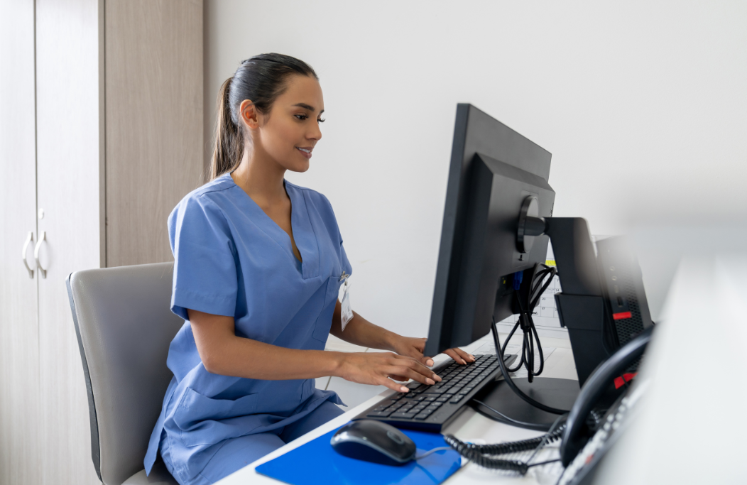 dental office manager works at her computer