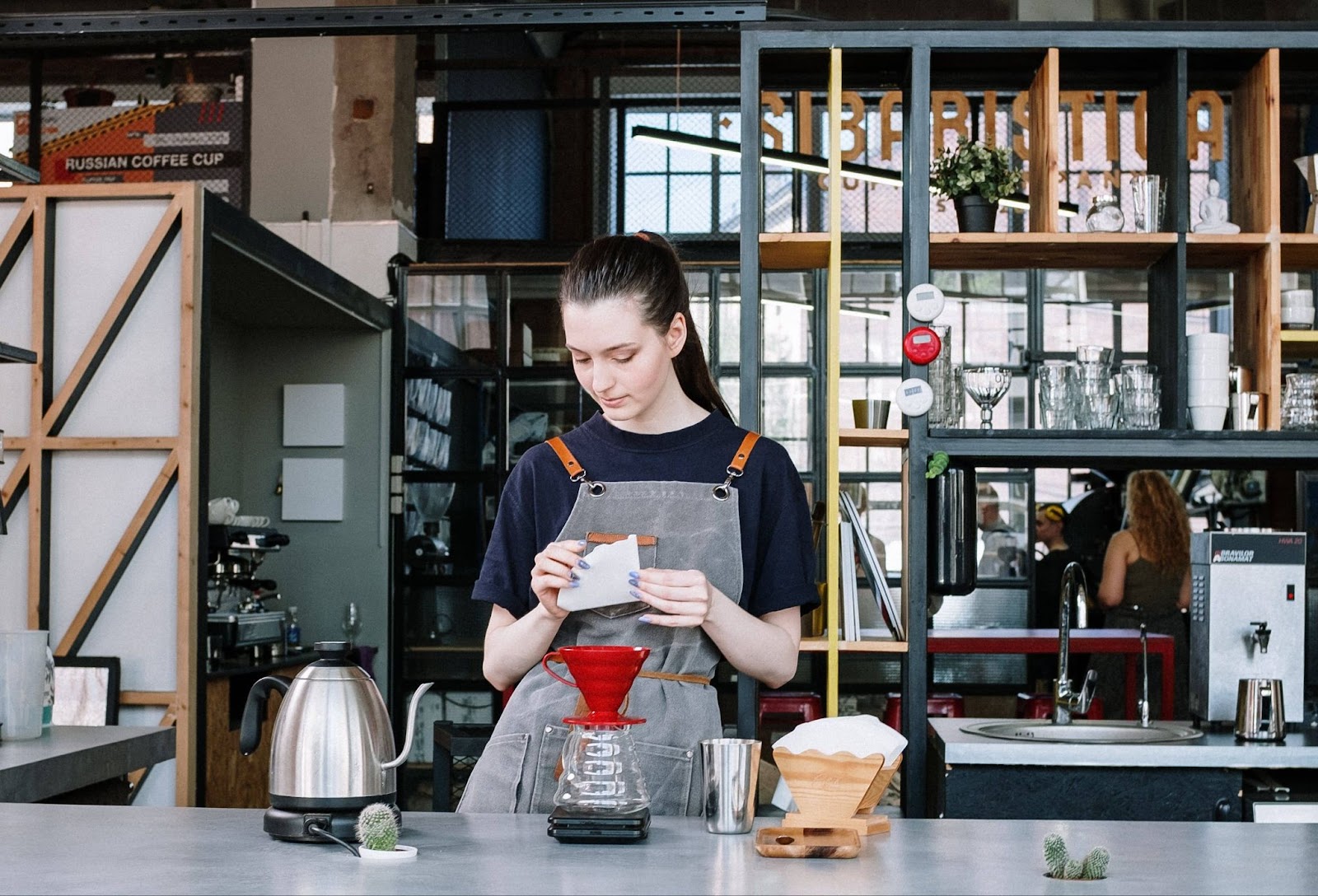 A Christian student working at their part-time job at a coffee shop