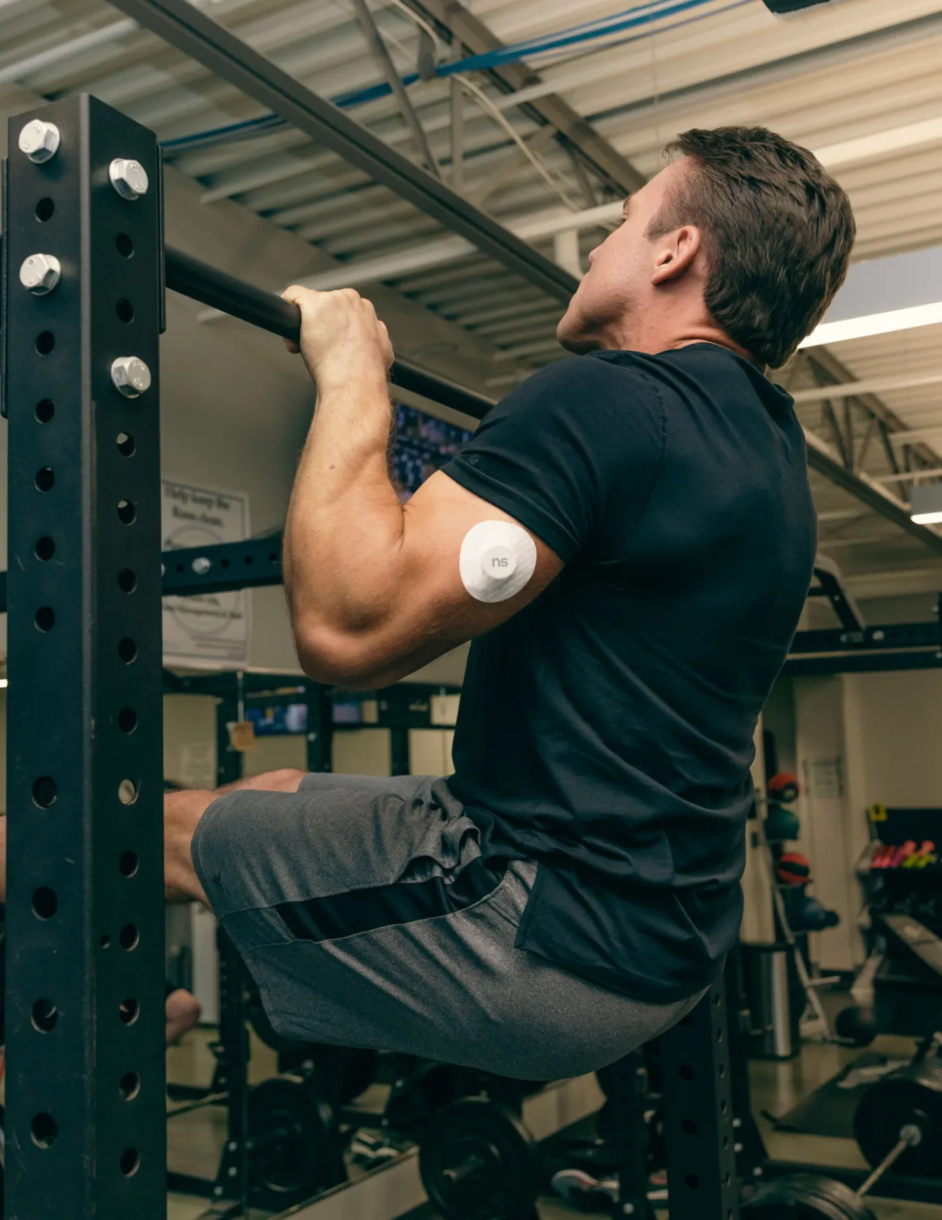 A man working out and wearing Nutrisense CGM